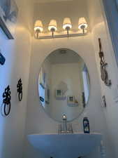 Bathroom with sink hard wood floors.