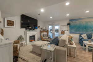 Living room with laminate flooring and french doors