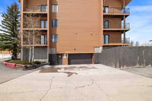 View of building exterior featuring a garage