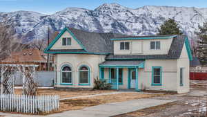 View of front of property with a porch and a mountain view