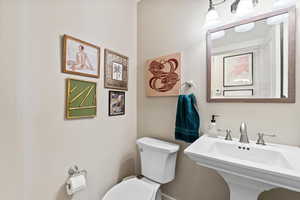 Bathroom featuring toilet and sink