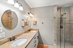 Bathroom featuring vanity and walk in shower