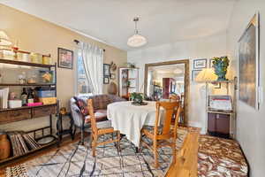 Dining area with light hardwood / wood-style flooring