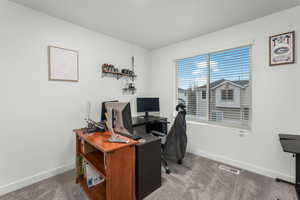 Home office featuring carpet flooring