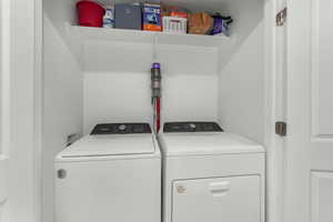 Laundry area featuring washer and clothes dryer