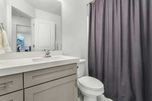 Bathroom with vanity and toilet