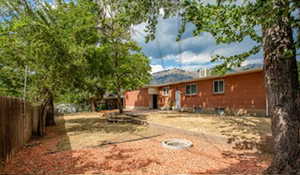 View of yard with an outdoor fire pit