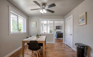 Dining area with dark hardwood / wood-style floors