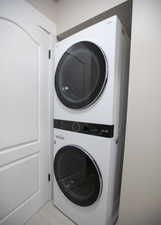 Laundry area with stacked washer / drying machine