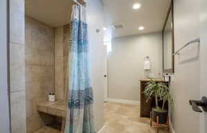 Bathroom featuring walk in shower