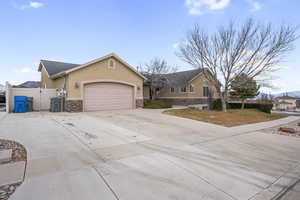 Ranch-style home featuring a garage & RV parking