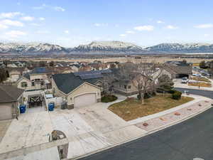 Exterior space featuring a garage, a mountain view, and solar panels