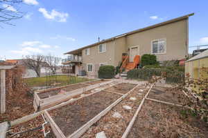 Back of house with a balcony