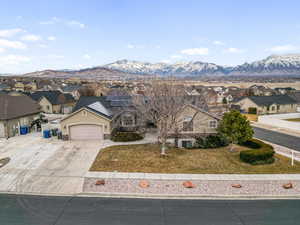 Front view of house on  corner lot featuring beautiful mountain views  and solar panels