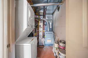 Basement featuring stackable washer and  dryer