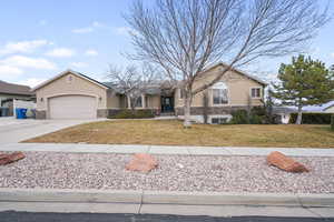 Single story home featuring a 2 car garage along with a 32X10 RV parking pad with hookup.