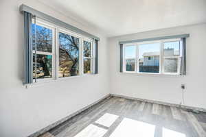 Spare room with light wood-type flooring