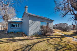 View of home's exterior featuring a yard