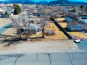 Birds eye view of property with a mountain view