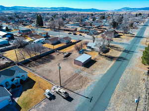 Birds eye view of property with a mountain view