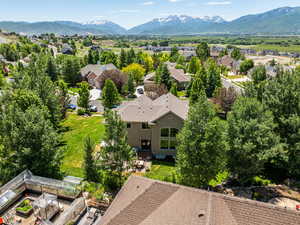 Birds eye view of property with a mountain view