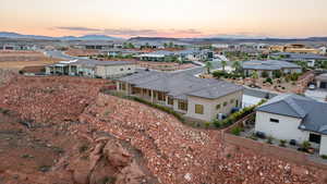 Aerial view at dusk featuring a mountain view