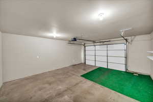 Garage featuring a garage door opener