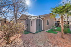 Back of property featuring a shed