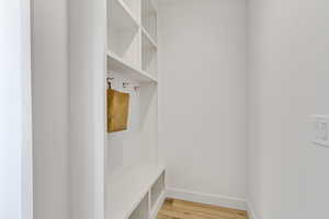 Mudroom with hardwood / wood-style flooring