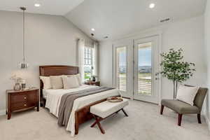 Primary Bedroom featuring access to exterior private balcony, light carpet, and lofted ceiling