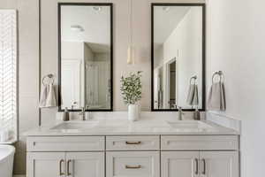 Primary Bathroom featuring a shower and vanity