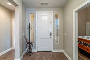 Entrance foyer featuring hardwood / wood-style flooring