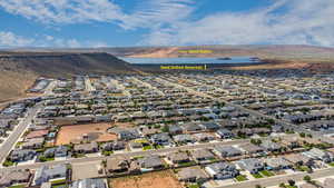 Drone / aerial view featuring a water and mountain view