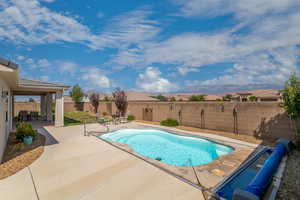 View of swimming pool with a patio and a mountain view