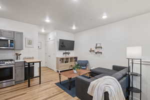 Living room with light wood-type flooring