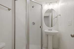 Bathroom with toilet and walk in shower