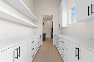 Hallway with light wood-type flooring