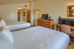 Bedroom featuring vaulted ceiling