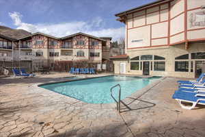 View of swimming pool featuring a patio