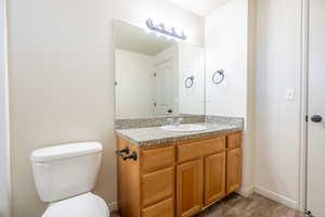 Bathroom with vanity and toilet