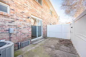 View of patio / terrace with fence and central AC unit