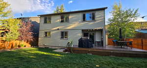 Back of house featuring a lawn