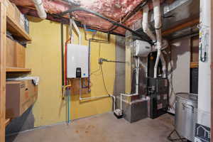 Utilities featuring tankless water heater