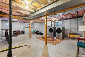 Basement featuring washing machine and clothes dryer