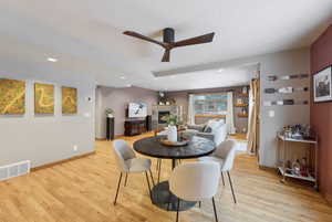 Dining space featuring light hardwood / wood-style flooring and ceiling fan