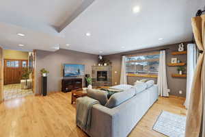 Living room featuring a fireplace and light wood-type flooring