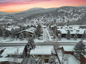 Snowy aerial view with a mountain view