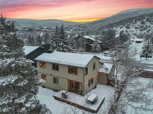 Snowy aerial view with a mountain view