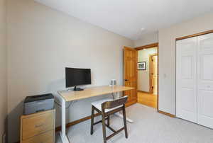 Office area featuring light colored carpet