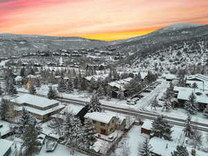 Snowy aerial view with a mountain view